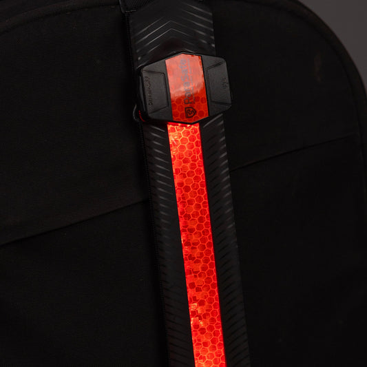 Backpack with a Parasafe reflective red strip on a dark background