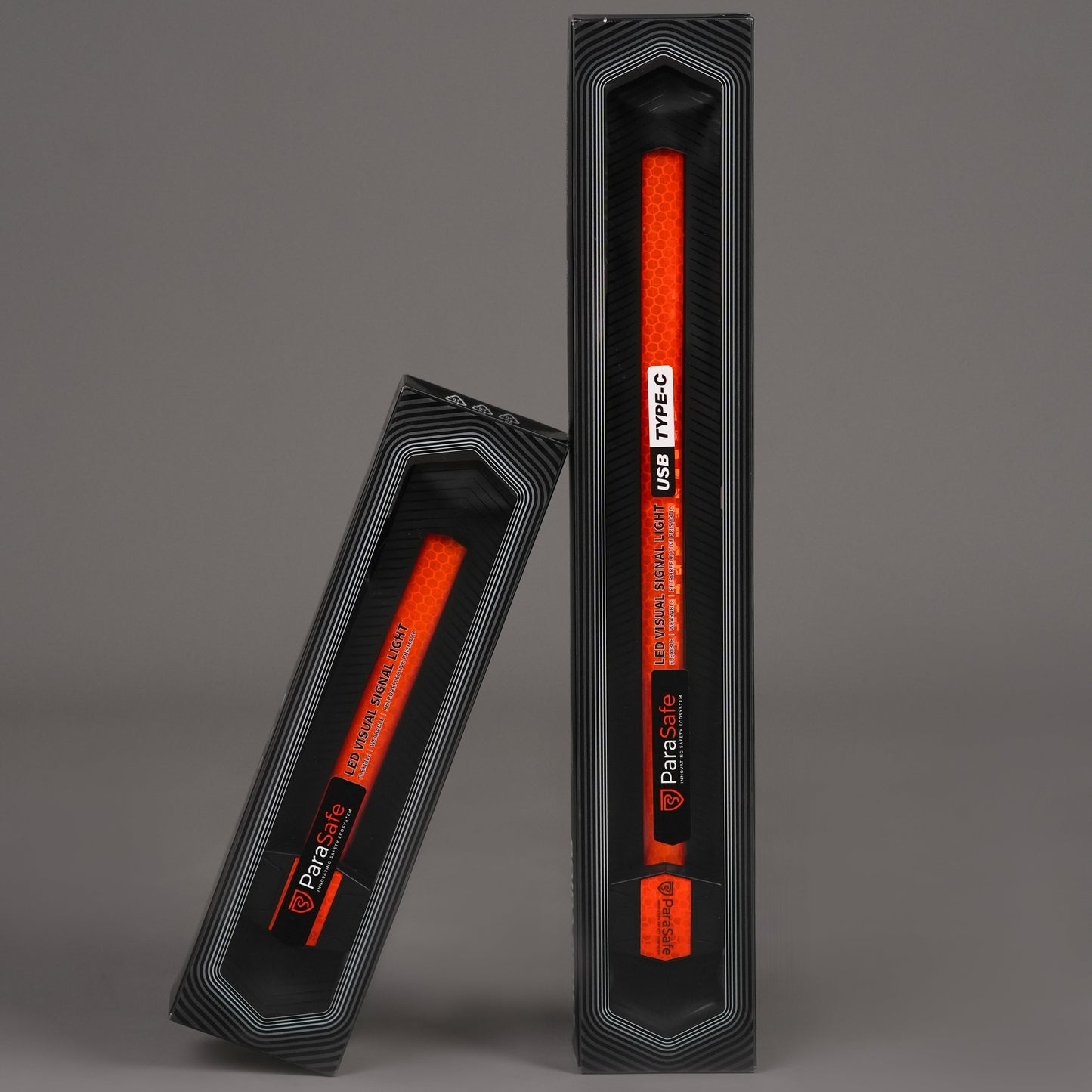 Two ParaSafe Red LED wearable strips in black packaging on a gray background