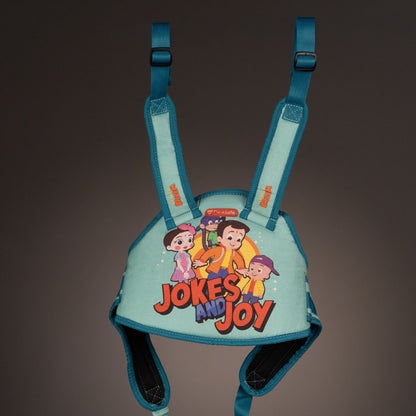 ParaSafe Sea Green Children's harness with cartoon characters and 'Jokes and Joy' text on a dark background