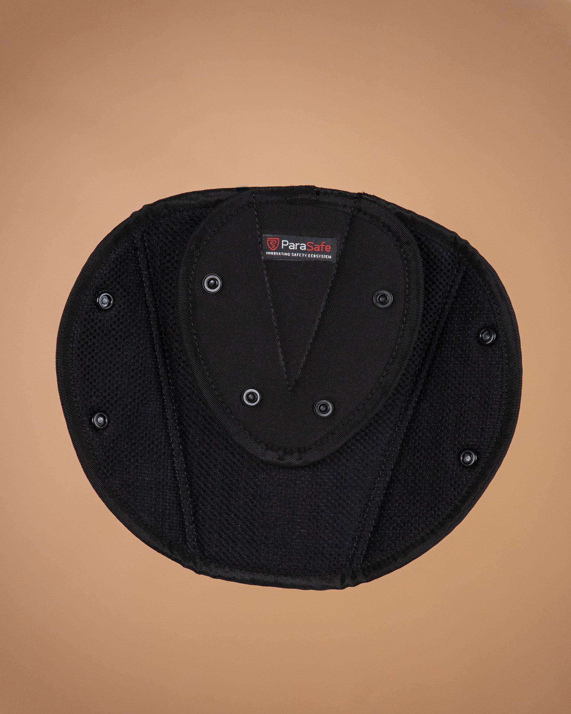 ParaSafe Black protective pad with a brand label on a brown background