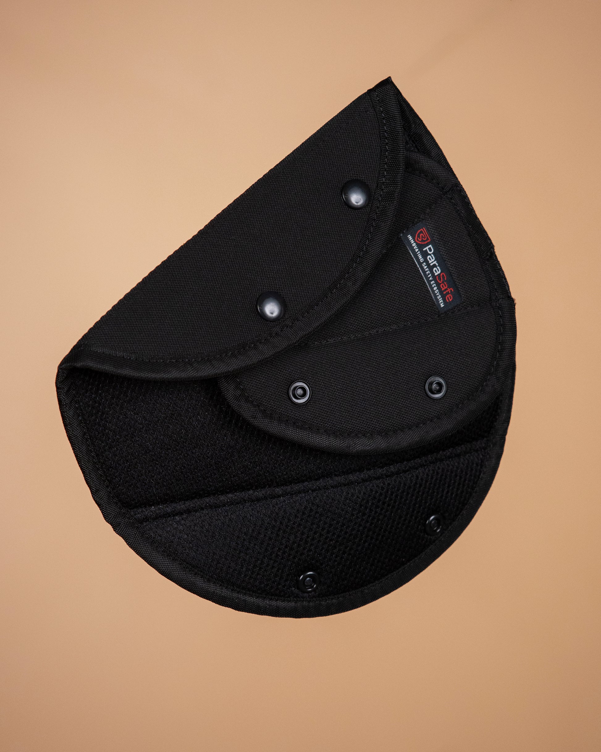 ParaSafe Black Seat belt comforter on a beige background