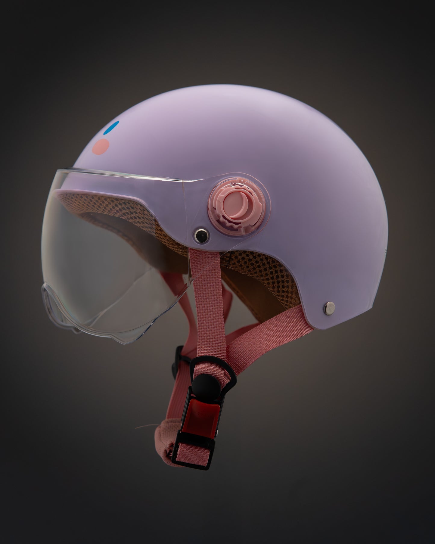 ParaSafe Light purple helmet with pink chin strap on a dark background